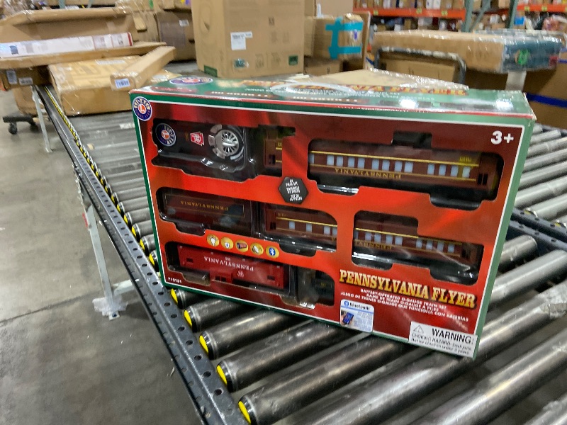 Photo 1 of Lionel Pennsylvania Flyer Battery O Gauge Toy Train Set with Remote, Locomotive, Train Cars, & Track with Authentic Train Sounds, Lights, & Water Vapor Smoke Effects for Kids 4+
