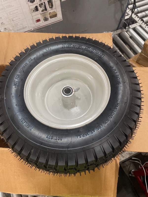 View 3 of 16x6.50-8 pneumatic tire and white wheel assembly featuring a centered bearing hub and grooved tread pattern. 2 PCS