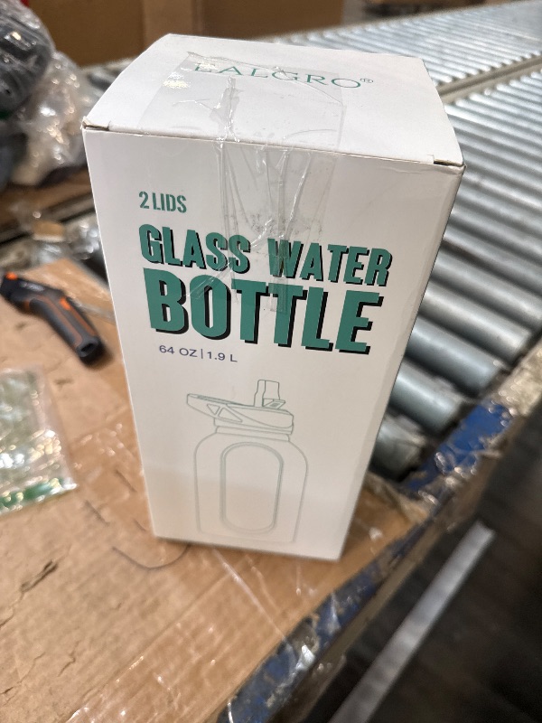 Photo 1 of ***DAMAGED LID*** ***STOCK PHOTO IS A DIFFERENT COLOR*** EALGRO 64 oz Glass Water Bottle With Straw and Handle, Half Gallon Sports Motivational Water Jug Flask with Silicone Sleeve, Large Water Cup with Time Marker for Travel, Gym, Beige