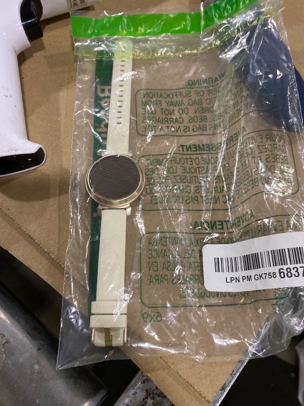 Photo 1 of Garmin Lily 2, Small and Stylish Smartwatch, Hidden Display, Patterned Lens, Up to 5 Days Battery Life, Coconut
