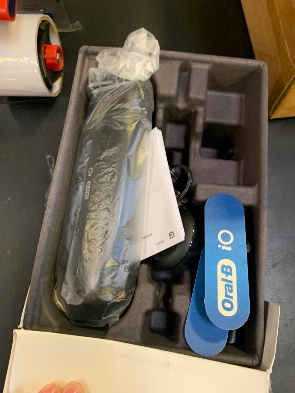 Photo 1 of Oral-B iO Series 8 Electric Toothbrush with 2 Replacement Brush Heads and Travel Case, Rechargeable Toothbrush, Black Onyx