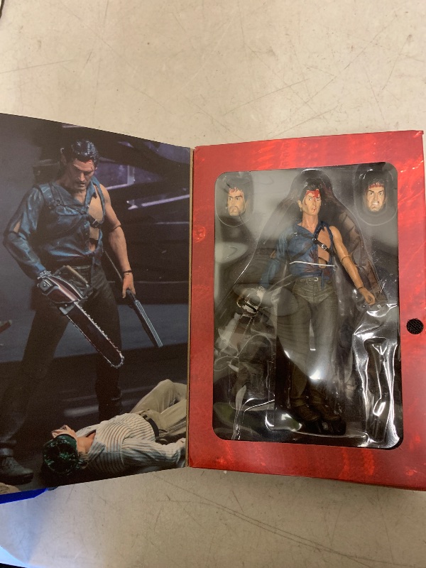View 2 of NECA Evil Dead 2 7" Ultimate Hero Ash Action Figure - Adult, Male, 7 Inch, Red, Black - Includes Three Interchangeable Heads, Chainsaw, Axe, Shotgun, Lantern, Tape Player