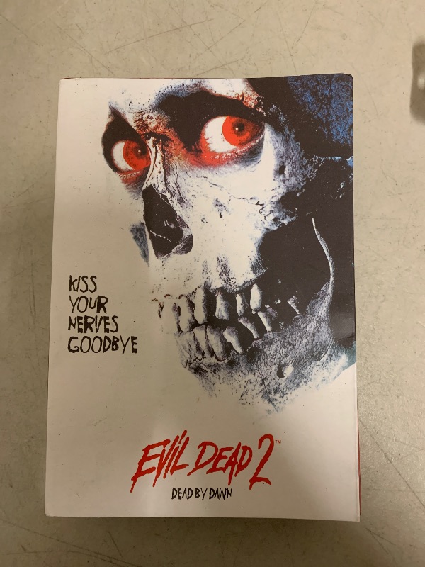 View 3 of NECA Evil Dead 2 7" Ultimate Hero Ash Action Figure - Adult, Male, 7 Inch, Red, Black - Includes Three Interchangeable Heads, Chainsaw, Axe, Shotgun, Lantern, Tape Player