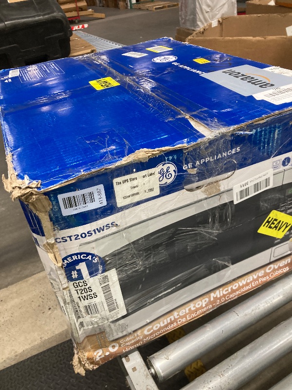Photo 1 of *Used/Scratched* GE Countertop Microwave Oven,1, 200-watt Capacity, 2.0 Cubic Ft., 8 Auto Setting Cooking Settings, Child-Lock Technology, Kitchen Essentials for the Countertop, Dorm Room or Apartment, Stainless Steel
