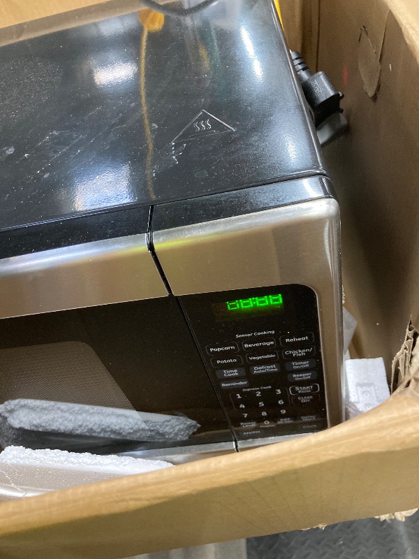Photo 1 of *Used/Scratched* GE Countertop Microwave Oven,1, 200-watt Capacity, 2.0 Cubic Ft., 8 Auto Setting Cooking Settings, Child-Lock Technology, Kitchen Essentials for the Countertop, Dorm Room or Apartment, Stainless Steel