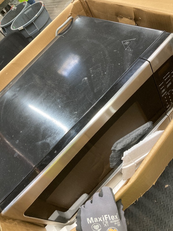 Photo 1 of *Used/Scratched* GE Countertop Microwave Oven,1, 200-watt Capacity, 2.0 Cubic Ft., 8 Auto Setting Cooking Settings, Child-Lock Technology, Kitchen Essentials for the Countertop, Dorm Room or Apartment, Stainless Steel