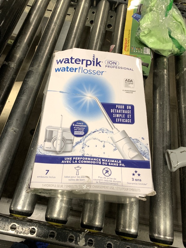 Photo 1 of Waterpik ION Professional Water Flosser, Rechargeable and Portable for Teeth, Gums, Braces, 10 Settings, 7 Flossing Tips For Multiple Users And Needs, ADA Accepted, WF-12 White, Packaging May Vary