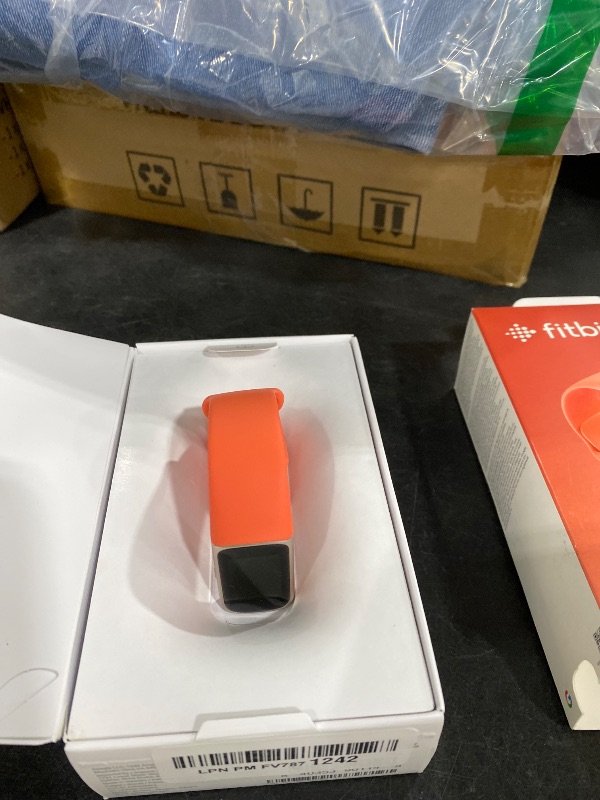 Photo 1 of Google Fitbit Charge 6 - Fitness Tracker - Gold/Coral