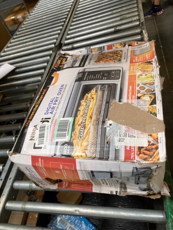 Photo 1 of [DENTED] [MAJOR DAMAGE!!] Ninja Digital Air Fryer & Toaster Oven | 8-in-1 Functionality | Flip-Up Design | XL Capacity | Air Fry Basket, Sheet Pan, Wire Rack & Crumb Tray | 1800 Watt | Silver | SP101