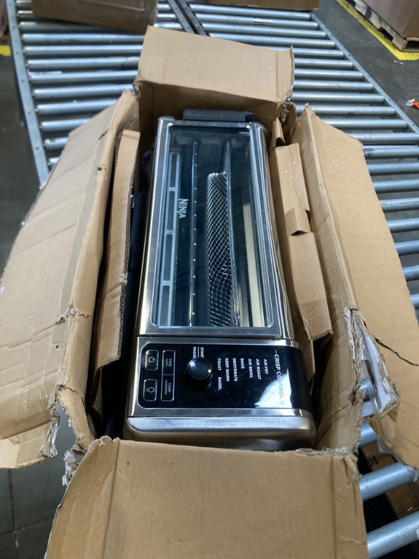Photo 1 of [DENTED] [MAJOR DAMAGE!!] Ninja Digital Air Fryer & Toaster Oven | 8-in-1 Functionality | Flip-Up Design | XL Capacity | Air Fry Basket, Sheet Pan, Wire Rack & Crumb Tray | 1800 Watt | Silver | SP101