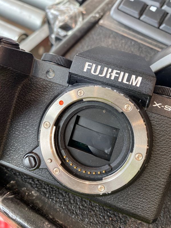 Photo 1 of [MAJOR DAMAGE] [MALFUNCTIONAL] [FOR PARTS] FUJIFILM X-S20 (26 MP, 6.2K 30P, FHD 240P 10x Slo mo, AI Processing,IBIS System, VLOG Mode) with Free TG-BT1 Bluetooth Tripod Hand Grip