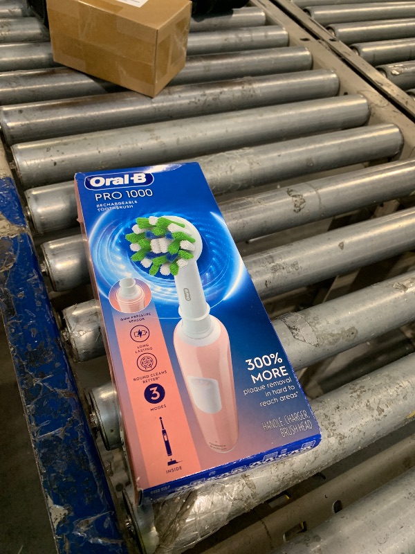 Photo 1 of **MISSING BRUSH HEAD**
Oral-B Pro 1000 Rechargeable Electric Toothbrush, Pink