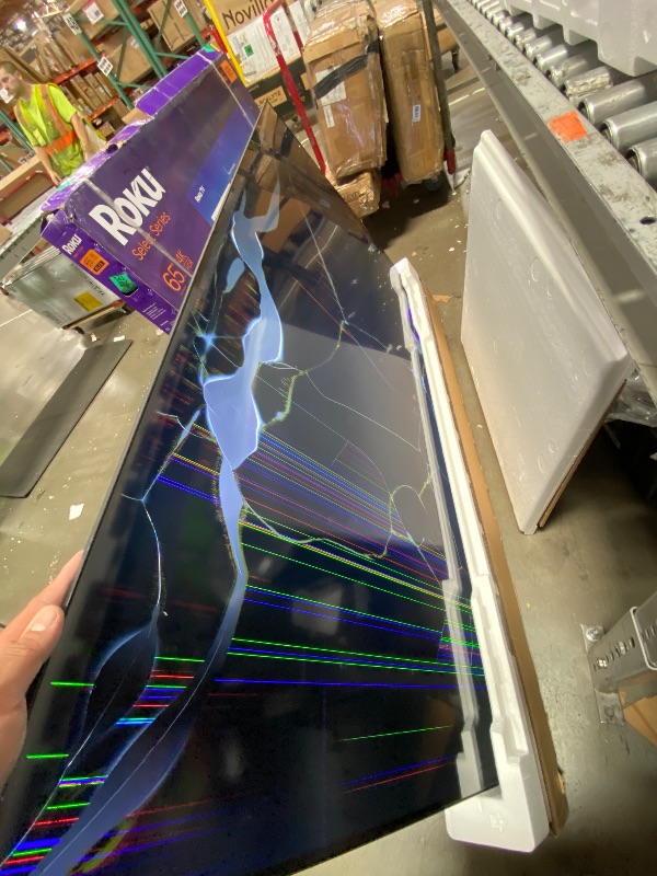 Photo 1 of **SEE PICTURES**Roku 65" QLED 4K Smart TV