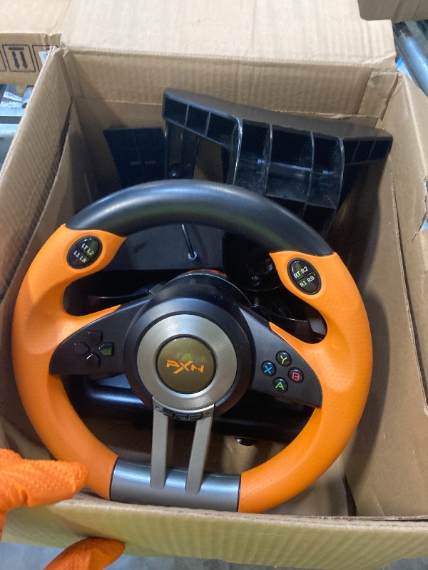 Photo 1 of ** USED** PXN PC Racing Wheel, V3 PRO 180 Degree Universal Usb Car Sim Race Steering Wheel with Pedals for PC, PS3, PS4, Xbox One, Xbox Series X/S, Switch (Orange)