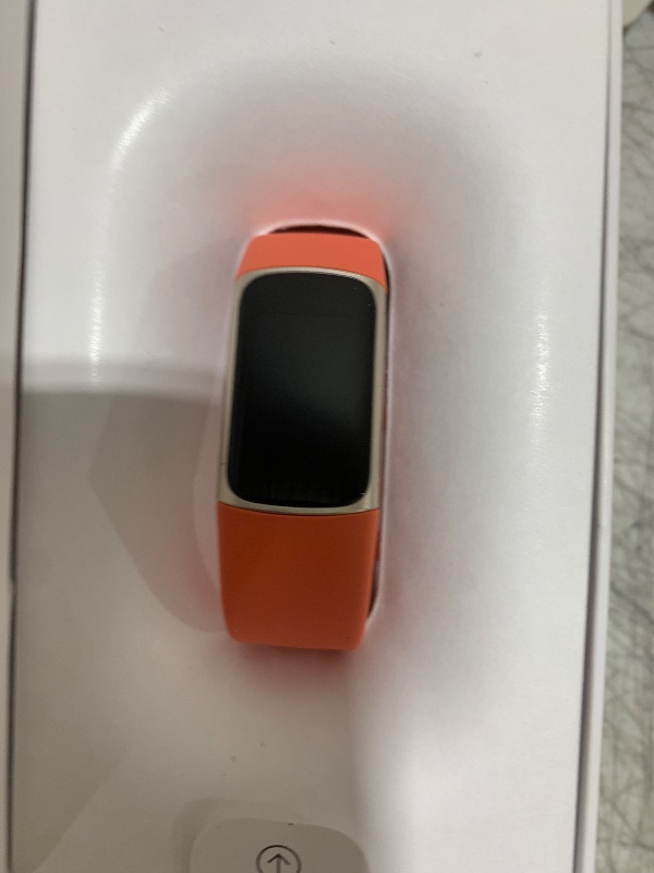 Photo 1 of Fitbit Charge 6 Fitness Tracker with Google Apps - Heart Rate on Exercise Equipment - 3-Month Google Health Premium Membership Included - Health Tools - Gold/Coral - Small&Large Bands Included