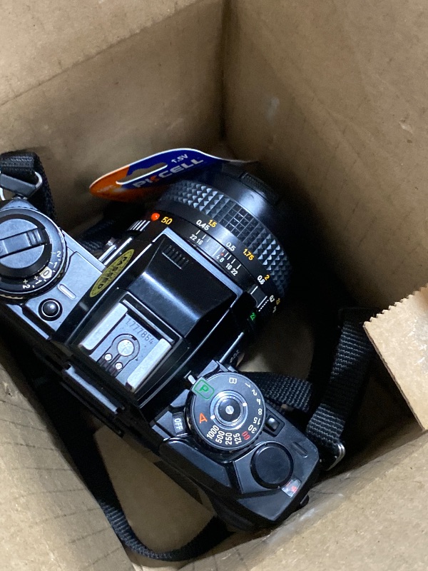 Photo 1 of Minolta X-700 35MM SLR Film Camera with MD mount lens System. Included 50mm f/2 Manual Focus Lens (Renewed)
