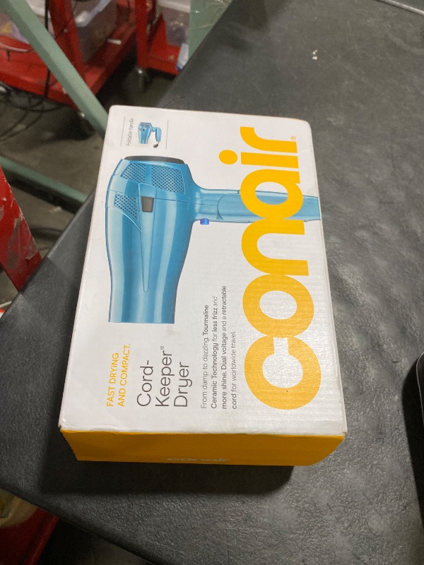 Photo 1 of Conair Cord-Keeper Dryer with Folding Handle and Retractable Cord, 1875W Travel Hair Dryer, Ionic Technology, Teal