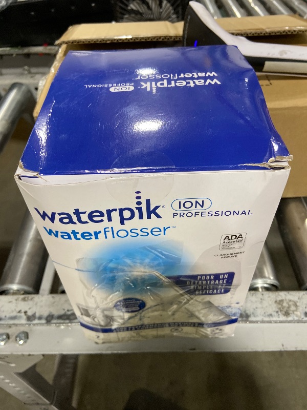 Photo 1 of Waterpik ION Professional Water Flosser, Rechargeable and Portable for Teeth, Gums, Braces, 10 Settings, 7 Flossing Tips For Multiple Users And Needs, ADA Accepted, WF-12 White, Packaging May Vary