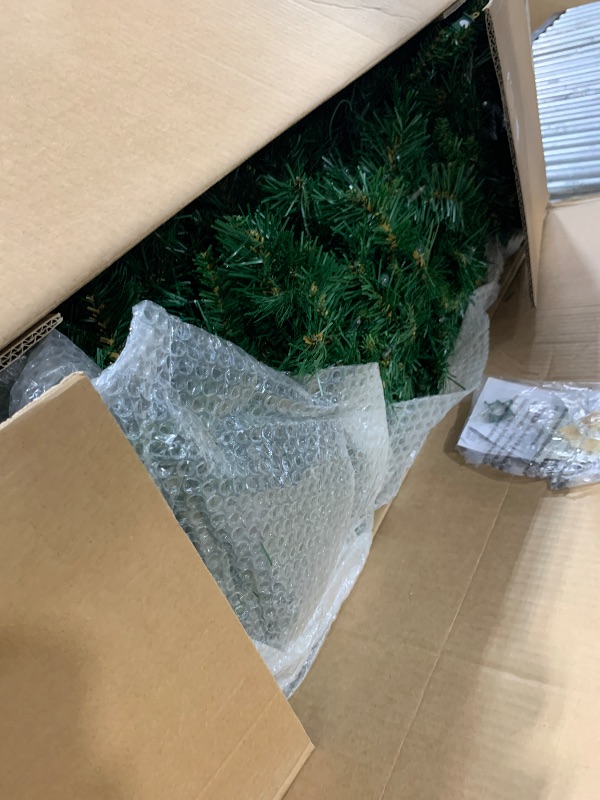 Photo 1 of National Tree Company Pre-Lit Artificial Slim Christmas Tree, Green, Tiffany Fir, White Lights, Includes Stand, 7.5 Feet
