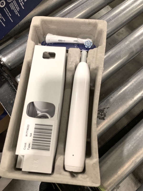 Photo 1 of Oral-B Rechargeable Electric Toothbrush, iO2 Starter Kit, 3 Cleaning Modes, Automatic Pressure Sensor to Protect Gums, 2 Brush Heads, Pure White