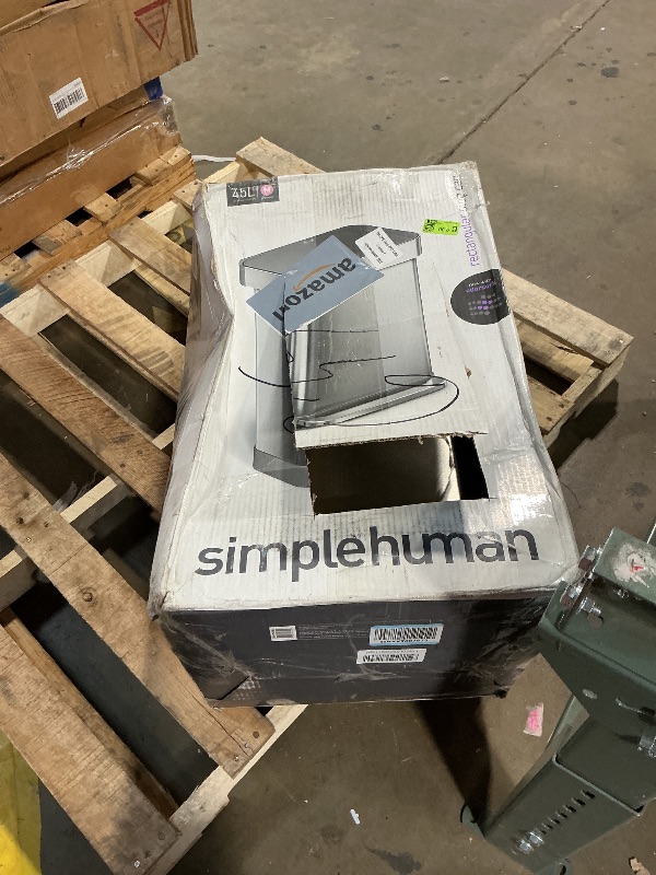 Photo 1 of **LARGE DENTS**
simplehuman Rectangular Step Can, 45L / 12 Gallon Kitchen Trash Can, Liner Rim System, Liner Pocket®, 150,000-Step Pedal, Lid Shox® Silent Close, Brushed Stainless Steel with Grey Plastic Lid