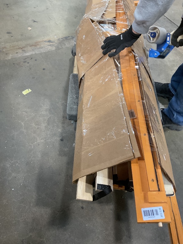 Photo 1 of ** MAJOR DAMAGE TO ONE BIG PIECE. SELLING FOR PARTS.**Wooden bed frame. Size unknown.