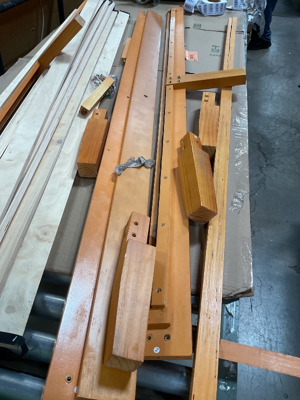 Photo 1 of ** MAJOR DAMAGE TO ONE BIG PIECE. SELLING FOR PARTS.**Wooden bed frame. Size unknown.