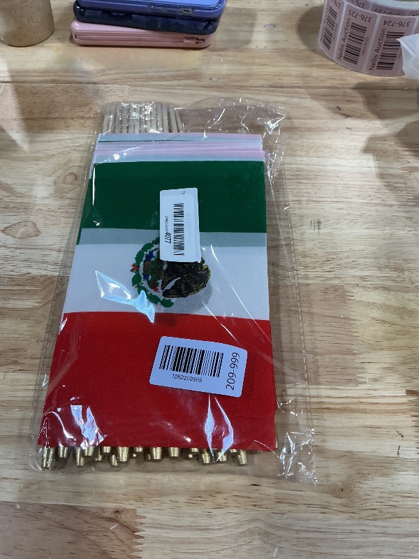 Photo 1 of 25 Pack Small Mexico Flags on Stick, 5x8 Inch Mini Mexican Hand Held Wooden Stick Flags with Spear Top for Parades, Celebrations, Parties, and Sports Events