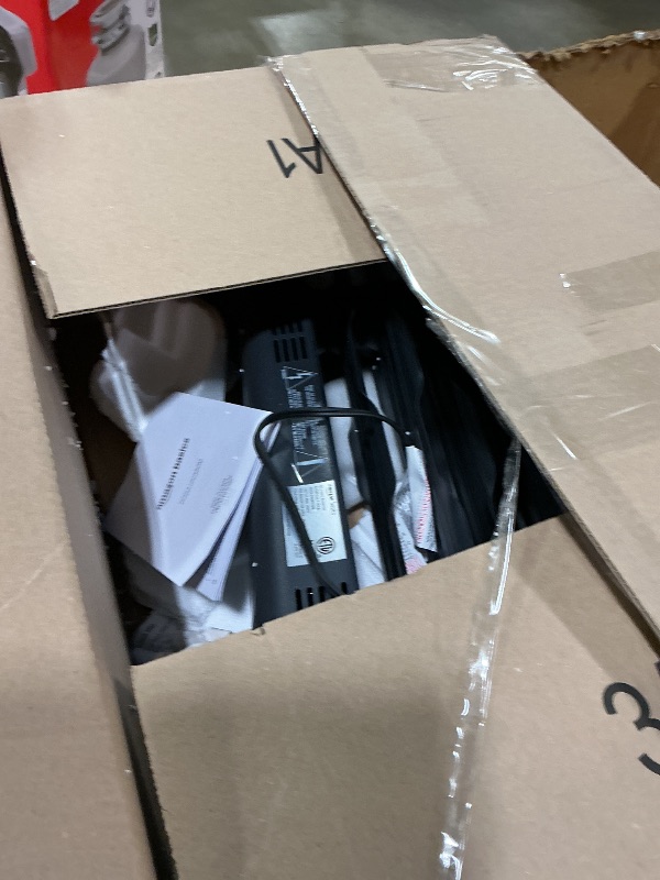 Photo 1 of **POSSIBLY FOR PARTS/ HAS DAMAGES *** Amazon Basics Portable Oil Space Heater with Remote Control, 7 Oil-Filled Fins, Adjustable Thermostat, 3 Heat Settings, Tip-Over and Overheat Protection, ETL Safety Certificate, 1500W, Black