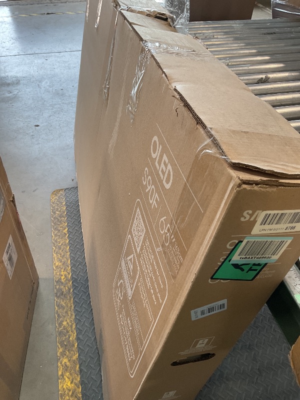 Photo 1 of ** MAJOR DAMAGE. SELLING FOR PARTS. **Samsung 65-Inch Class OLED S90F 4K Smart TV (2025 Model) NQ4 AI Gen3 Processor, Upscaling Pro, HDR +, Motion Xcelerator 144Hz, Vision, Alexa Built-in