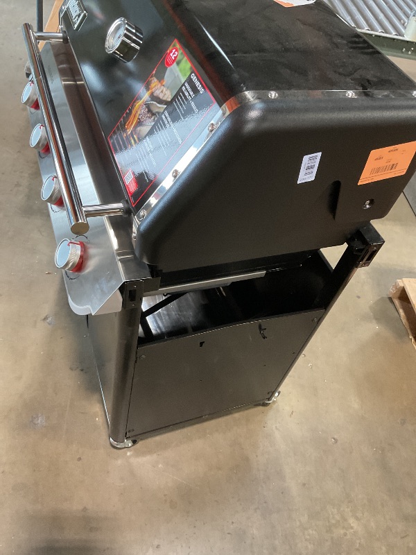 Photo 1 of **DIRT/SCRATCHES**Genesis E-415 4-Burner Liquid Propane Gas Grill in Black with Side Tables