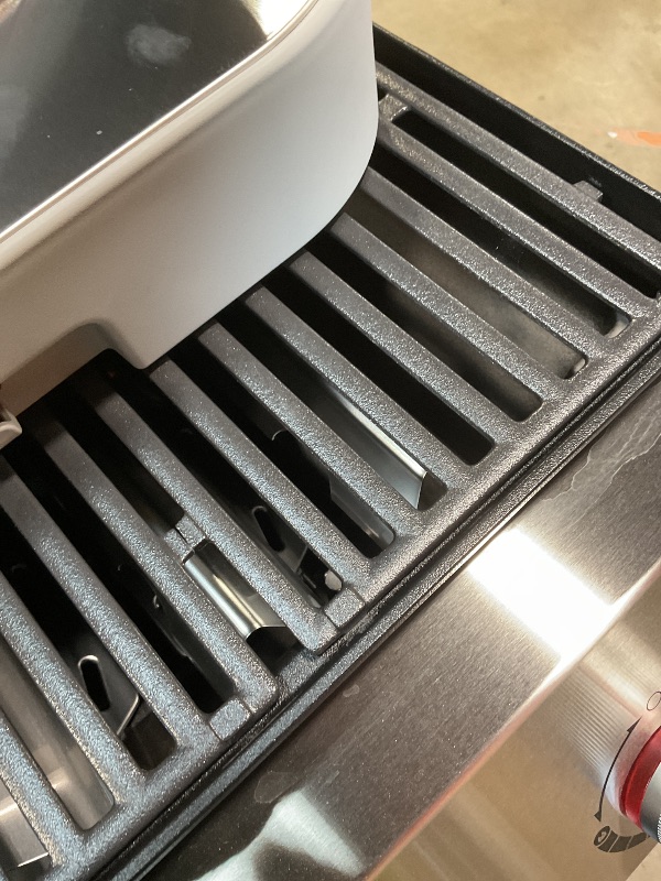 Photo 1 of **DIRT/SCRATCHES**Genesis E-415 4-Burner Liquid Propane Gas Grill in Black with Side Tables