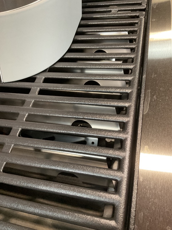Photo 1 of **DIRT/SCRATCHES**Genesis E-415 4-Burner Liquid Propane Gas Grill in Black with Side Tables