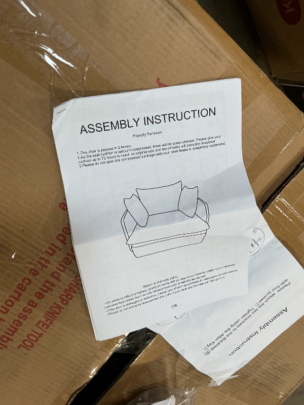 Photo 1 of **2 BOXES**One pair of beige chairs.