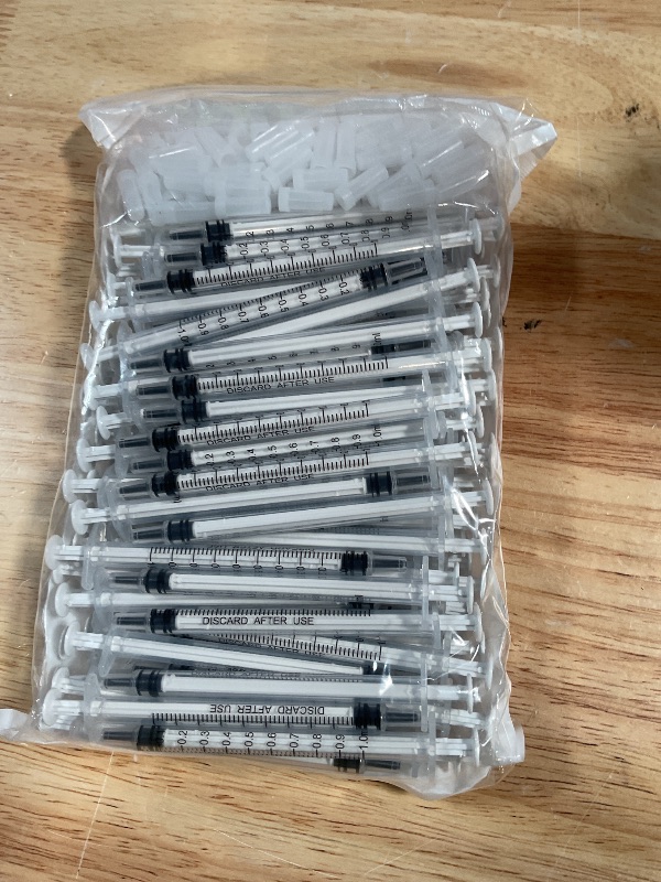 Photo 1 of 100 Pack 1ml Syringe with Cap for Liquid, 1cc Plastic Small Syringes with Cover, Non-Sterile, No Needle