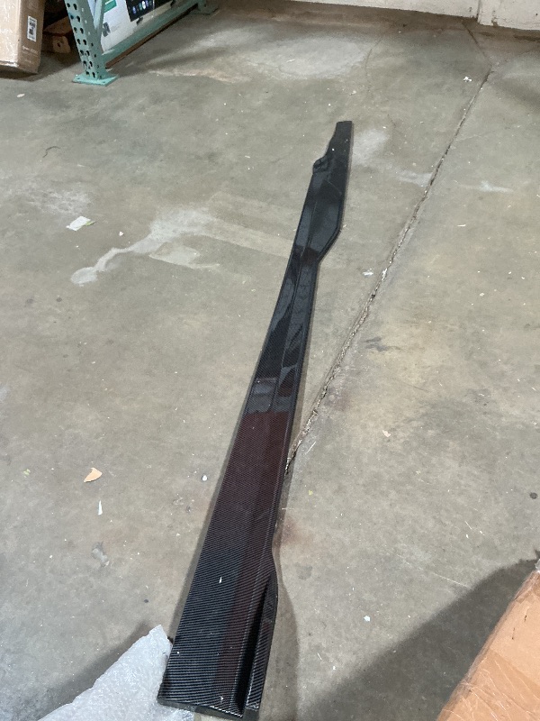 Photo 1 of **dirt/scrapes**Carbon fiber side skirts. Model unknown