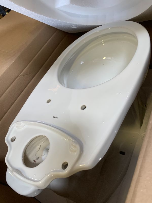 Photo 1 of TOTO Drake Two-Piece Elongated 1.6 GPF Universal Height TORNADO FLUSH Toilet with CEFIONTECT, Cotton White - CST776CSFG#01