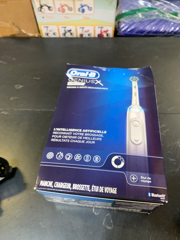 Photo 1 of Oral-B Genius X Limited Rechargeable Electric Toothbrush with 1 Replacement Brush Head, Travel Case, White