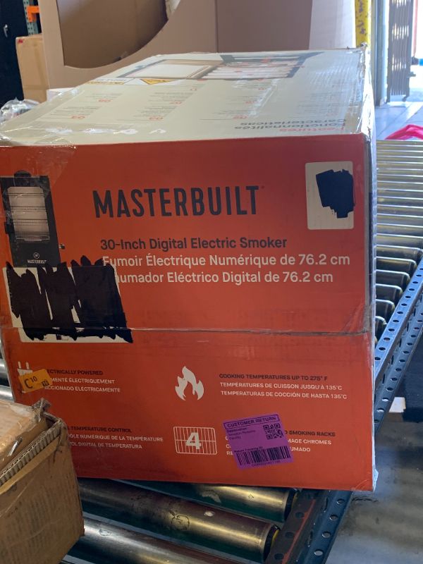 Photo 1 of Masterbuilt® 30-inch Digital Electric Vertical BBQ Smoker with Leg Kit, Side Wood Chip Loader and 710 Cooking Square Inches in Black, Model MB20070421