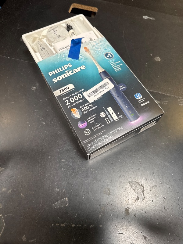 Photo 1 of Philips Sonicare 7300 Series Electric Toothbrush - Next-Generation Sonicare Technology, Pressure Sensor, 12 Brushing Settings, SmarTimer, 21-Day Runtime, Travel Case, Navy Blue, HX7423/05