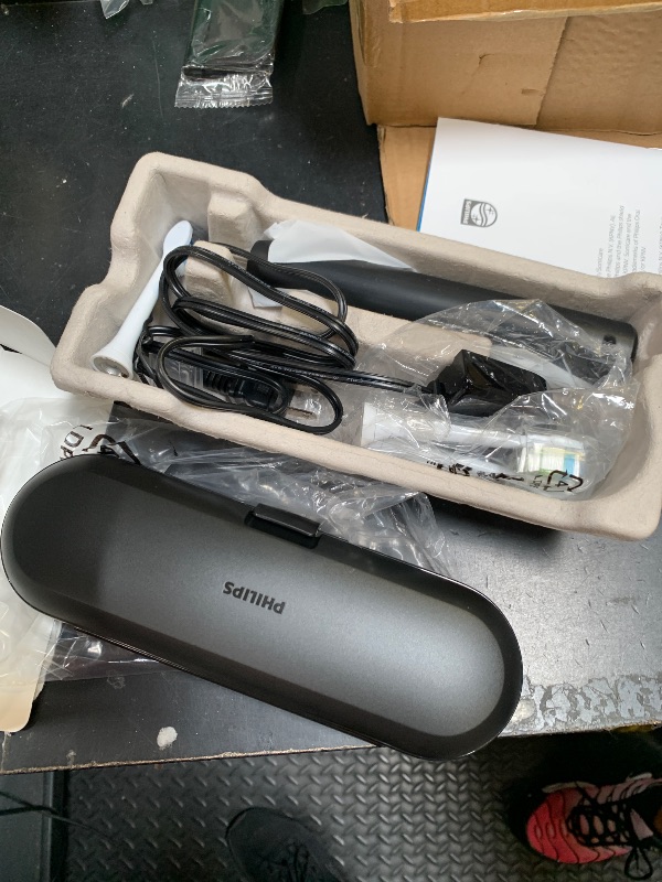 Photo 1 of Philips Sonicare ProtectiveClean 5300 Rechargeable Electric Toothbrush, with Pressure Sensor, 3 Cleaning Modes, SmarTimer and QuadPacer, with 2 Bonus Brush Heads, Travel Case, Black, Model HX6423/34