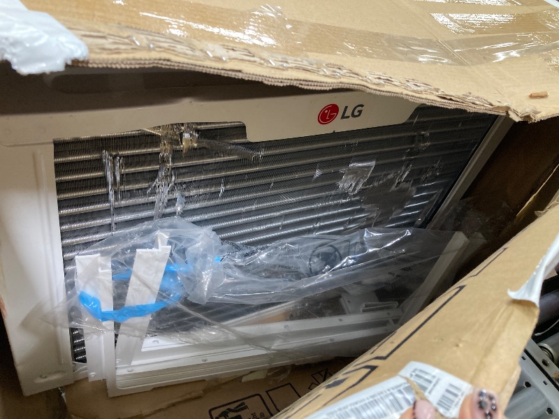 Photo 1 of ***DAMAGED -SELLING AS IS *** LG 23,000 BTU Smart Window Air Conditioner with Heat, 230V, Air Conditioner Cools Rooms up to 1,400 Sq.Ft., Smartphone & Voice Control works with Remote, White