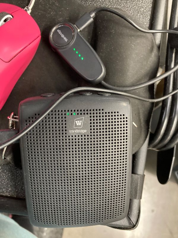 Photo 3 of  WinBridge WB002 Wireless Voice Amplifier. This portable device is designed to amplify your voice clearly and effectively, making it ideal for teachers, tour guides, coaches, presenters, and anyone who needs to project their voice to a group. Its lightwei