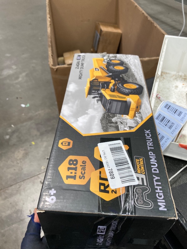 Photo 1 of ***Missing Controller, batteries, and cable***Mighty 9-Channel RC Dump Truck Toy | 1:18 Scale All-Terrain 6-Wheel Construction Vehicle with Lights & Sounds, 6 Wheels & 100-Min Battery, Remote Control Truck for Kids & Adults, Great STEM Gift 2026***Missing