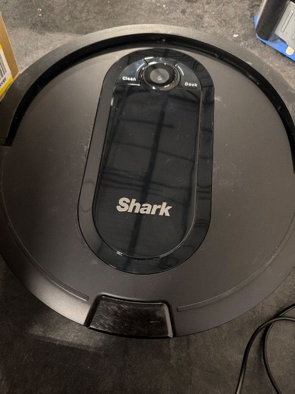 Photo 1 of **View Clerk Notes**[USED] Shark AV1010AE IQ Robot Vacuum with XL Self-Empty Base, Bagless, 45-Day Capacity, Advanced Navigation, Alexa & Wi-Fi, Multi-Surface Brushroll, for Pets, Dander & Dust, Carpet & Hard Floor, Black