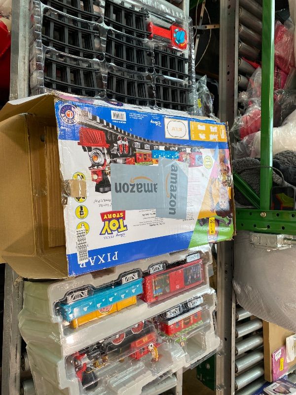 Photo 1 of [CLERK NOTES] [USED] [UNTESTED] Lionel Battery-Operated Disney Toy Story Toy Train Set with Locomotive, Train Cars, Track & Remote with Authentic Train Sounds, & Lights for Kids 4+