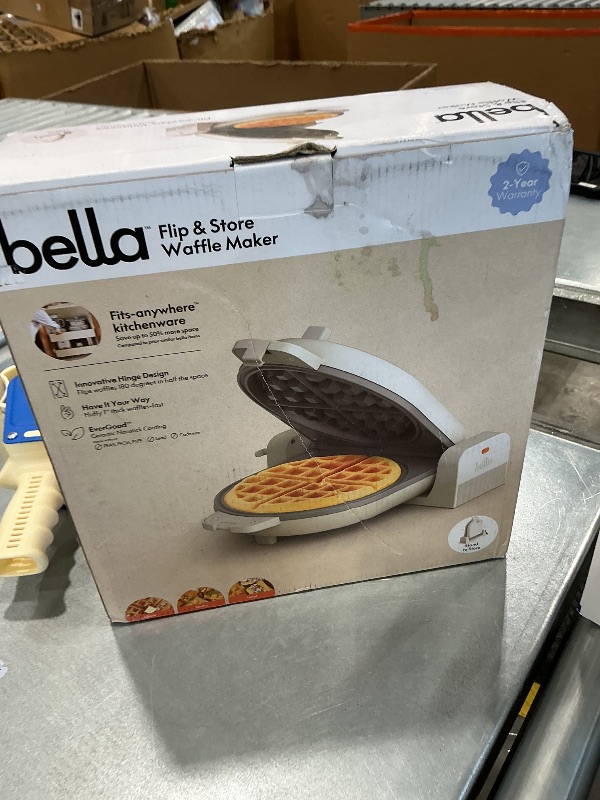 Photo 1 of [Outer Shell Cracked] bella Flip-n-Store Waffle Maker with EverGood™ Ceramic Nonstick Coating, Fits-anywhere™ Kitchenware, Power Indicator Light, Cool Touch Handle & Cord Wrap, 7” Wide & 1" Deep Plates, 1000 Watt, Oatmilk