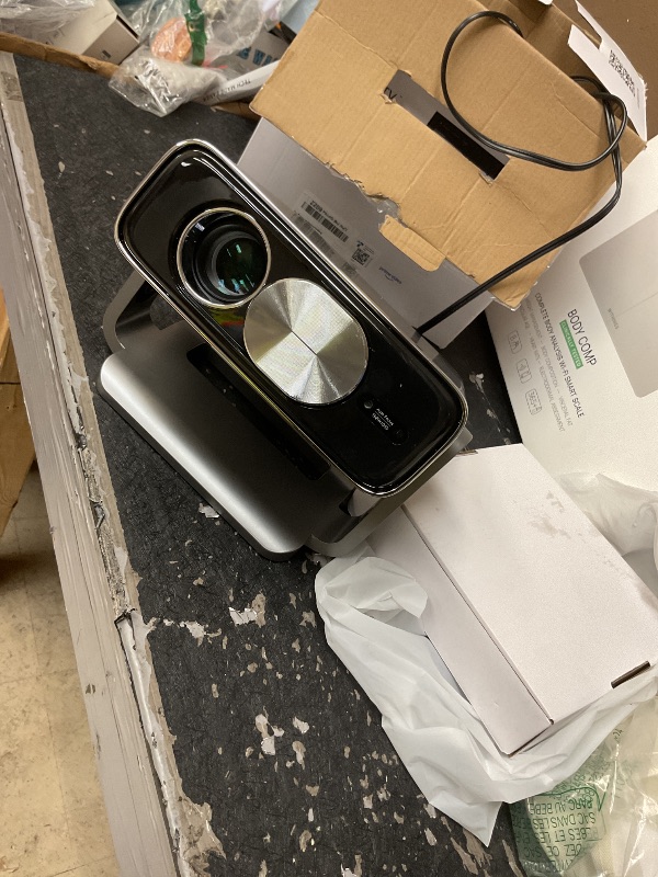 Photo 1 of Smart 4K Projector [Bundled with Google TV Stick] with WiFi and Bluetooth, 2500ANSI, Auto Lens Cap, Portable Outdoor Movie Projector with Built-in Apps Auto Focus for Ceiling/Home Theater/Bedroom