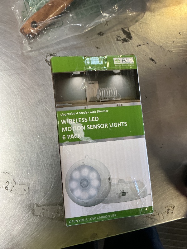 Photo 1 of Reoshine Under Cabinet Lighting, LED Puck Lights AA Battery Operated, Closet Lights Motion Sensored for Kitchen, Shelf, Dimmable & Magnetic, 3000K Warm White (6 Pack)