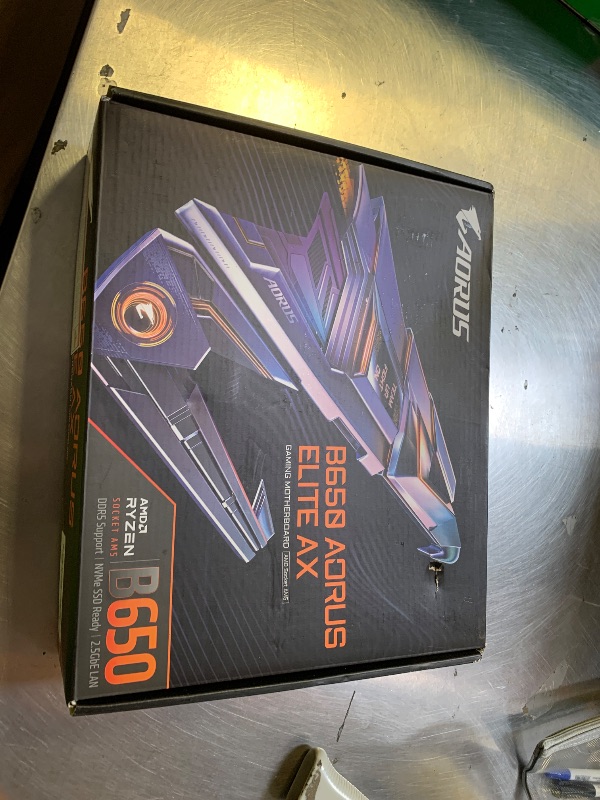 Photo 1 of GIGABYTE B650 AORUS Elite AX AMD AM5 ATX Motherboard, Support Ryzen 9000/8000/7000 Series, DDR5, 14+2+1 Power Phase, PCIe 5.0 M.2, USB-C 3.2 Gen 2, WIFI6E, 2.5GbE, EZ-Latch, Q-Flash, RGB Fusion